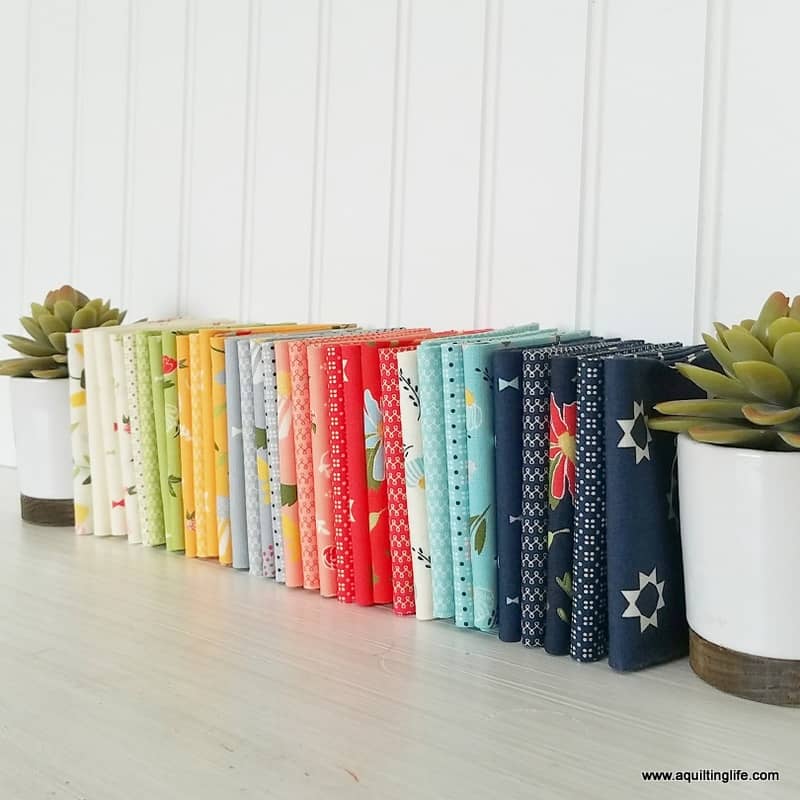 Sewing Room Organization featured by top US quilting blog, A Quilting Life: image of Clover Hollow fabric library stack