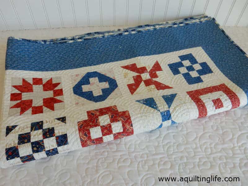 red blue and cream quilt folded