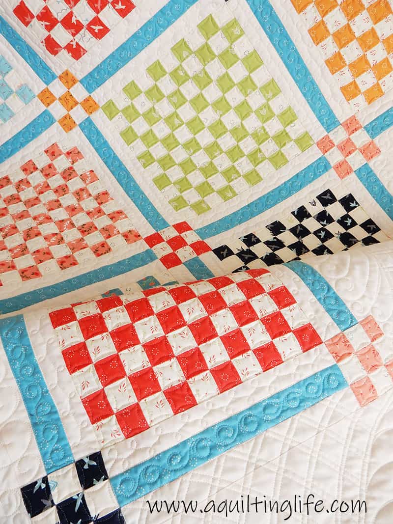 Scrap Quilt Ideas & Tips featured by top US quilting blog, A Quilting Life: image of Patchwork Garden Quilt