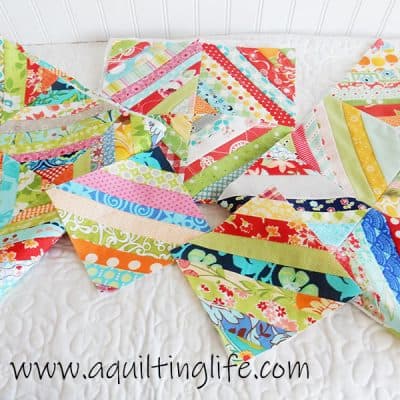 Scrap Quilt Ideas & Tips featured by top US quilting blog, A Quilting Life: image of Scrappy string blocks