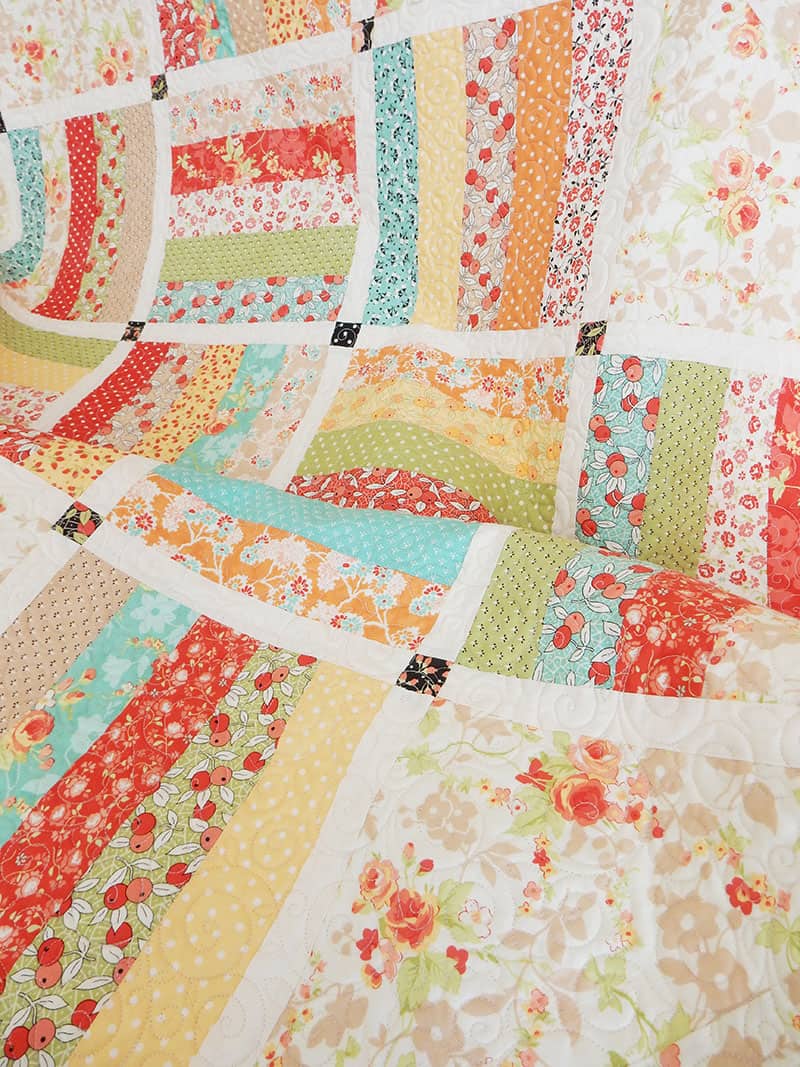 Tips for Pressing Quilt Strip Sets featured by top US quilting blog, A Quilting Life: image of Dreamin Quilt by A Quilting Life