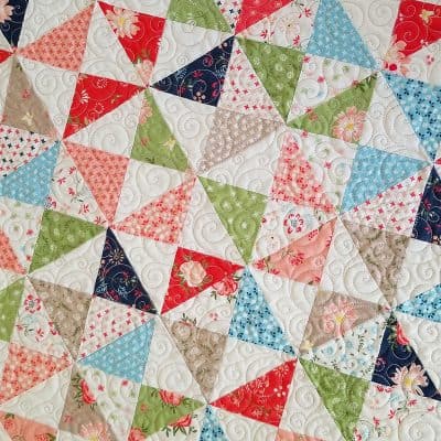 Moda Summer Charm Swap: Charm Square Table Runner by popular quilting blog, A Quilting Life: image of a Moda pattern and Harper's Garden light fabric charm table runner