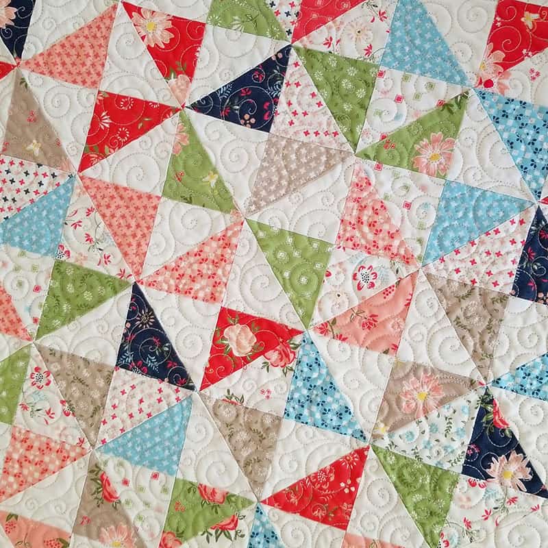 Moda Summer Charm Swap: Charm Square Table Runner by popular quilting blog, A Quilting Life: image of a Moda pattern and Harper's Garden light fabric charm table runner 