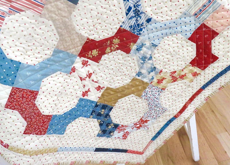 Moda Summer Charm Swap | Table Topper Quilt by popular quilting blog, A Quilting Life: image of a North Port Collection fabric table topper quilt.