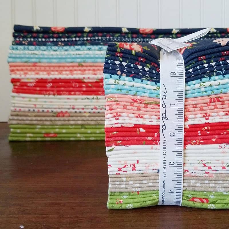 Merry Mini Quilt Christmas Quilt Along by popular quilting blog, A Quilting Life: image of two Harper's Garden fabric bundles.