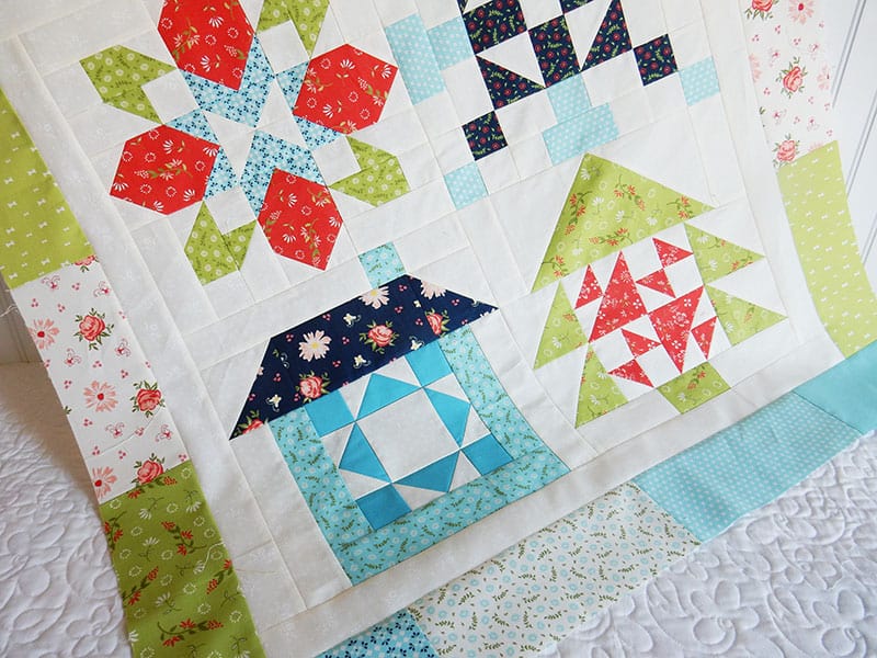 Merry Mini Christmas Sew Along | Merry Mini Christmas Sew Along Finishing Instructions | Tree Block by popular quilting blog, A Quilting Life: image of a Merry Mini Christmas Sew Along Block quilts.