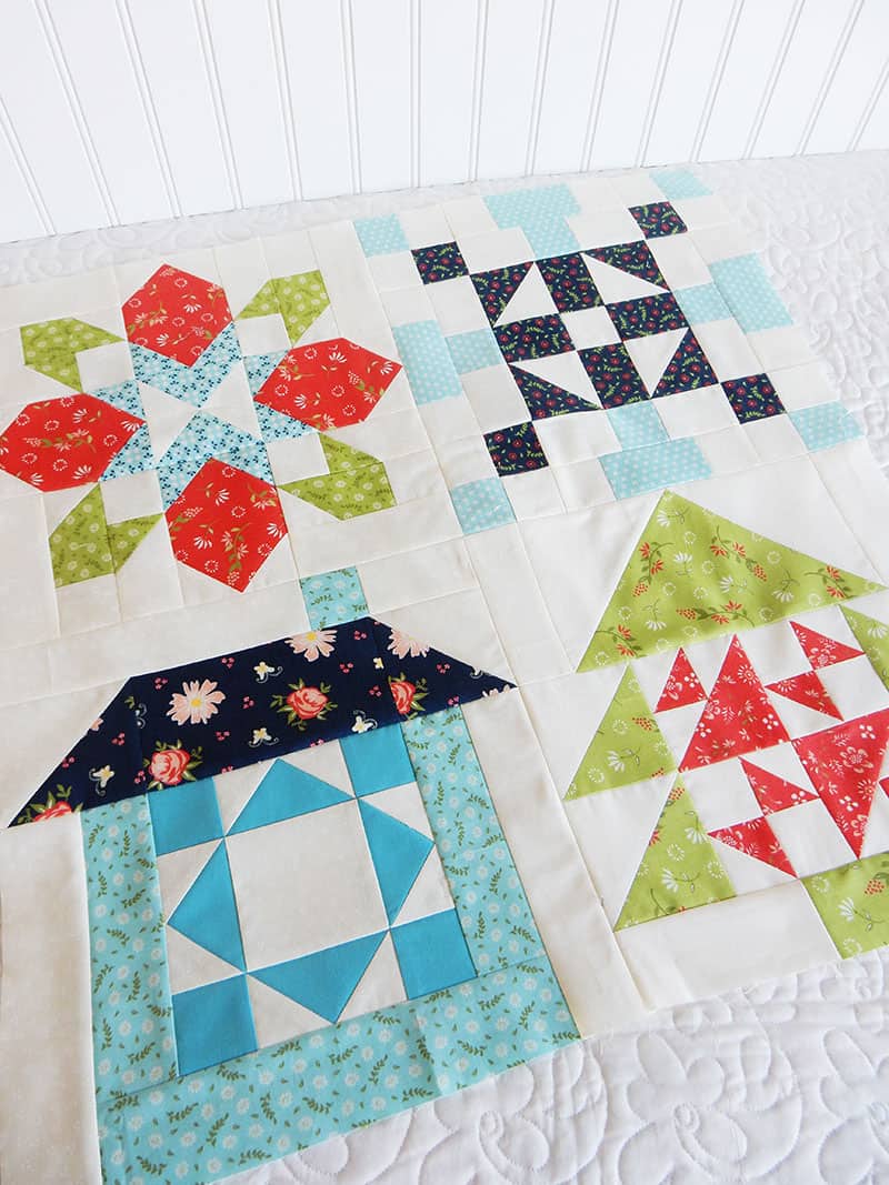 Christmas Mini Quilt | Merry Mini Christmas Quilt | Merry Mini Christmas Quilt Sew Along Finishing Instructions by popular quilting blog, A Quilting Life: image of a Merry Mini Christmas Sew Along Block quilts.