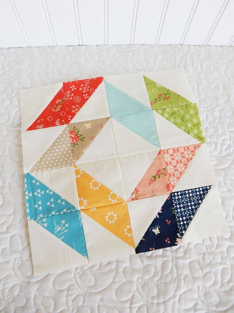 Quilting Life block of the month block 1 August | Quilting Life Quilt Block of the Month | August 2019 by popular quilting blog, A Quilting Life: image of half square triangle block quilt.
