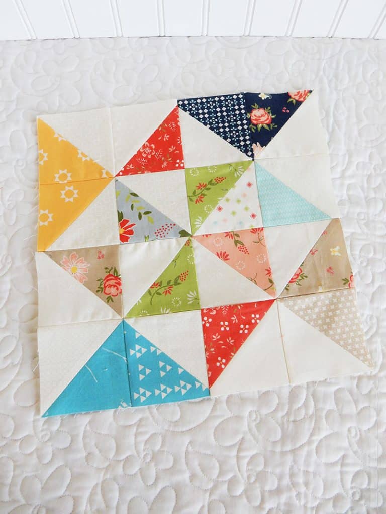 a quilting life block of the month august block 2 | August blocks |Quilting Life Quilt Block of the Month | August 2019 by popular quilting blog, A Quilting Life: image of half square triangle block quilt.
