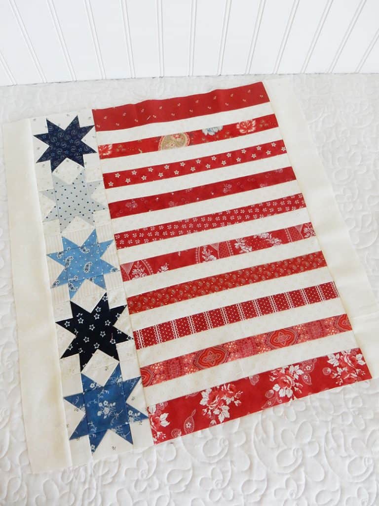 Stars and Stripes | Amazing 4th of July Quilts! by popular quilting blog, A Quilting Life: image of red, white, and blue patriotic pillow cover.