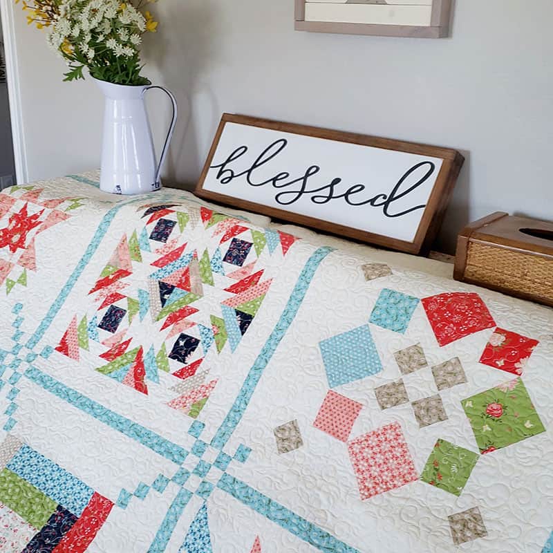 Sunday Best Sampler | Sew Your Stash: Quilting Systems & Routines by popular quilting blog, A Quilting life: image of a sampler quilt draped over a table.