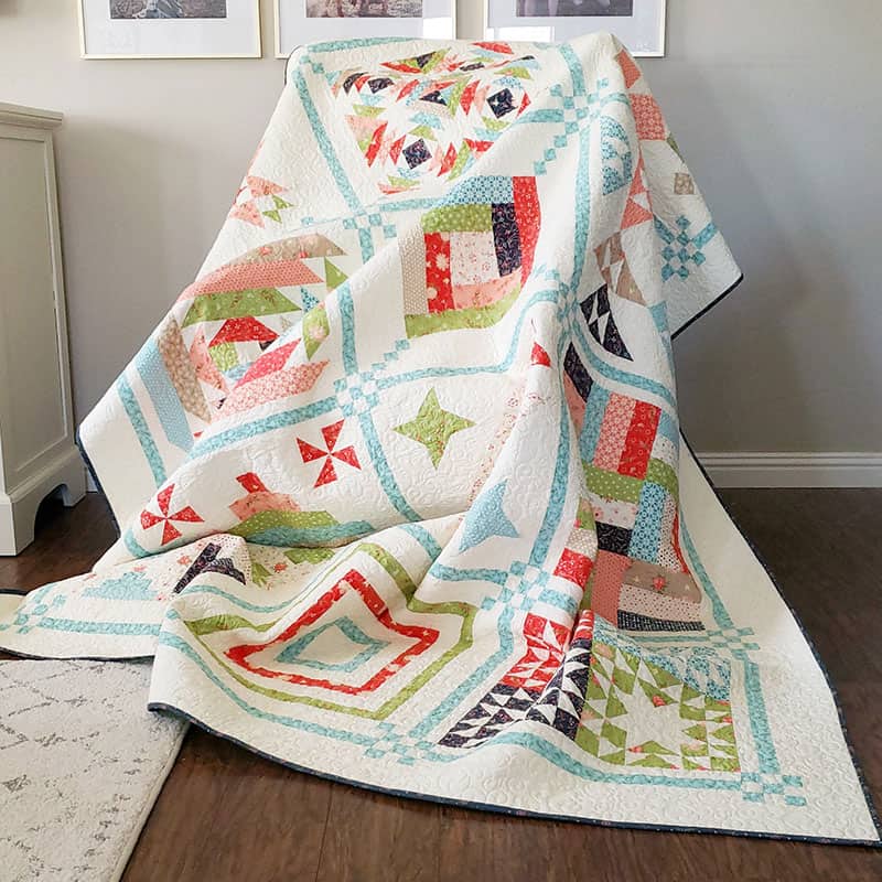 Moda Schoolhouse Blog Hop | Free 18" Block Pattern by popular quilting blog, A Quilting Life: image of a My Sunday Best Quilts Sampler in Harper's Garden fabrics.