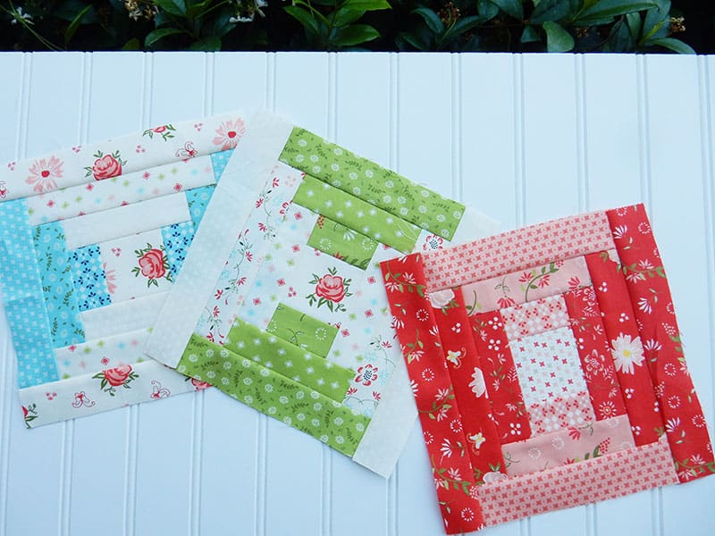 Courthouse steps quilt blocks | Courthouse Steps Quilt Block Tutorial by popular quilting blog, A Quilting Life: image of 3 small courthouse steps quilt blocks.
