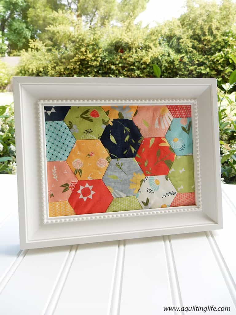 framed hexagons | Sew Your Stash: Quilting Systems & Routines by popular quilting blog, A Quilting life: image of framed English Paper pieced hexagons.