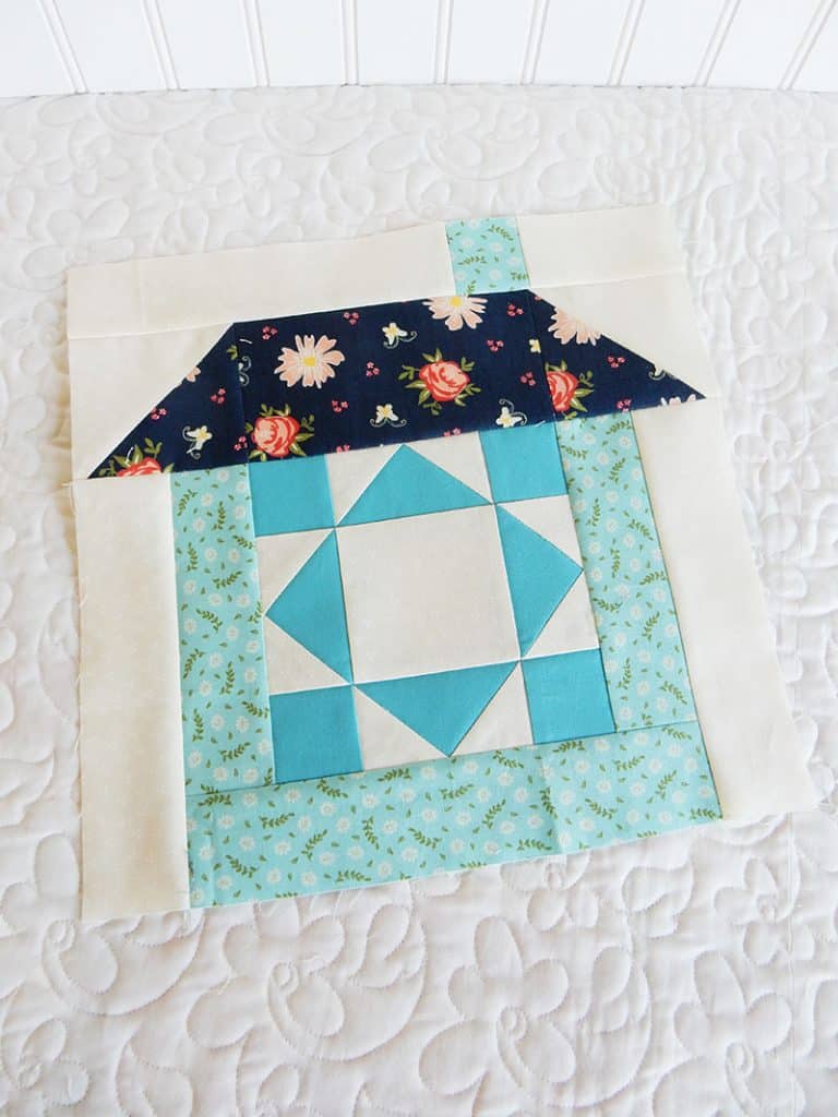 Merry Mini Christmas Sew Along Block 3 by popular quilting blog, A Quilting Life: image of a house block quilt.