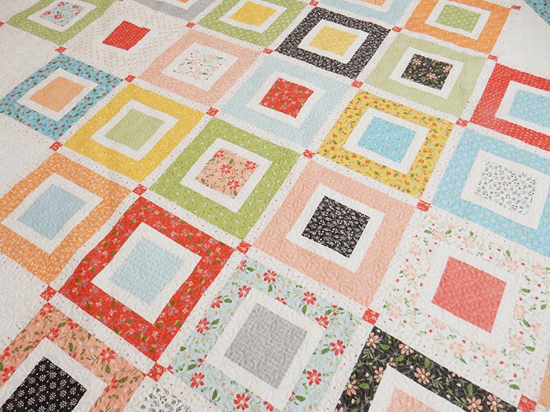 Beach Day Jelly Roll Quilt | Jelly Roll Beach Day Quilt Pattern by popular US quilting blog, A Quilting Life: image of a beach day quilt made with Summer Sweet fabric.