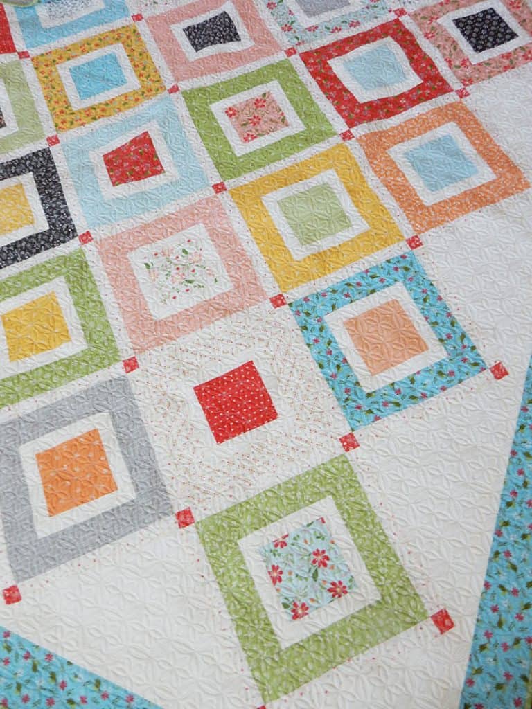 Jelly Roll Beach Day Quilt Pattern by popular US quilting blog, A Quilting Life: image of a beach day quilt made with Summer Sweet fabric.