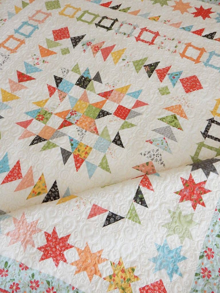 Gelato Medallion Quilt Pattern by popular US quilting blog, A Quilting Life: image of a Gelato Medallion quilt with scrappy star center.