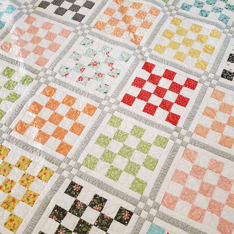 Patchwork Garden 2 Quilt | Jelly Roll Quilt Pattern by popular quilting blog, A Quilting Life: image of a Patchwork Garden 2 quilt.