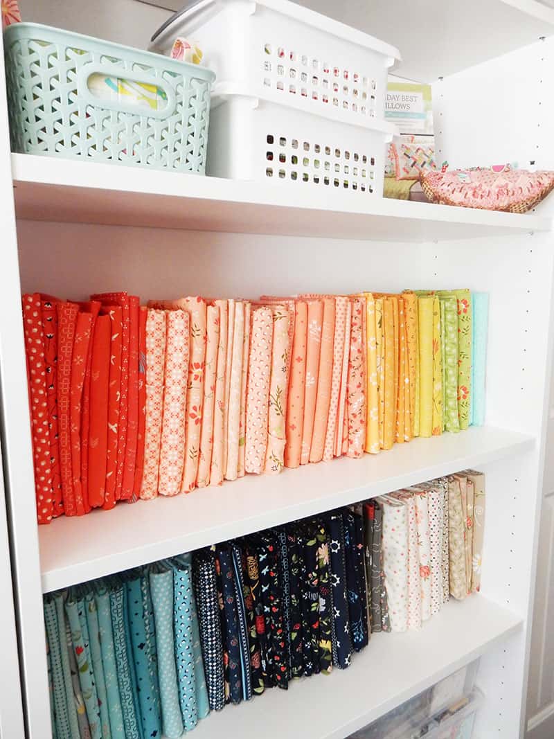 Sewing Room Layout Ideas: 5 Tips to Set up Your Sewing Space featured by top US quilting and sewing blog: image of Fabric Storage on shelves