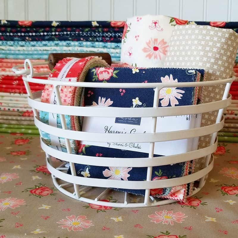 Harper's Garden Pre-cuts | Harper's Garden Shop Update & Life Lately by popular US quilting blog, A Quilting Life: image of a metal basket with Harper's  Garden Shop pre-cut fabrics.