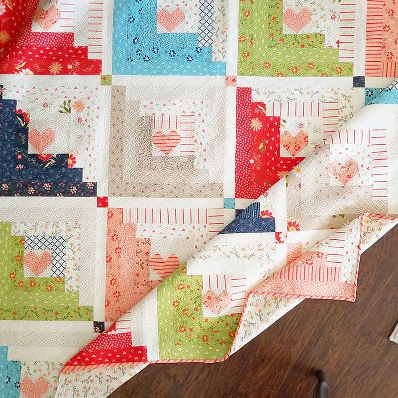 Hearts at Home Jelly Roll Quilt | National Sew a Jelly Roll Day by popular quilting blog, A Quilting Life: image of a Hearts at Home Jelly Roll quilt.