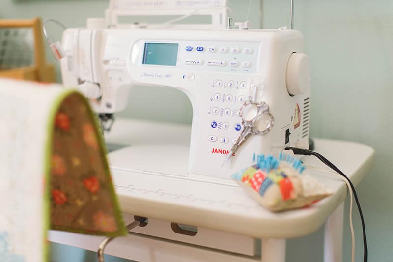 Sewing Room Layout Ideas: 5 Tips to Set up Your Sewing Space featured by top US quilting and sewing blog.: image of Janome Sewing Machine

