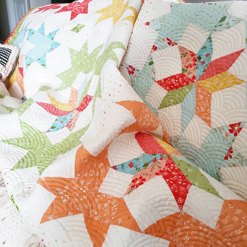 Starlight Fat Quarter Quilt | Starlight Fat Quarter Quilt Pattern by popular quilting blog, A Quilting Life: image of a star block fat quarter quilt.