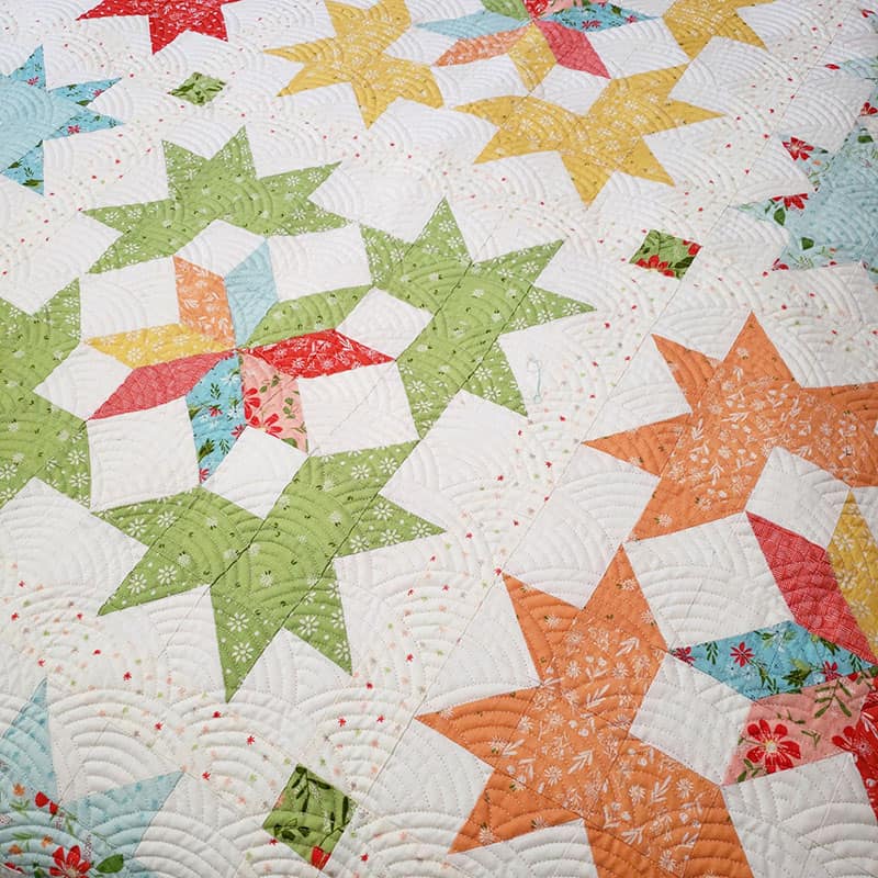 Starlight Fat Quarter Quilt Pattern by popular quilting blog, A Quilting Life: image of a star block fat quarter quilt.