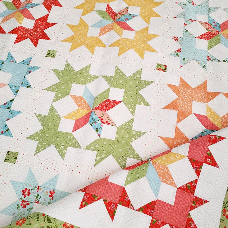 Starlight Fat Quarter Quilt Pattern by popular quilting blog, A Quilting Life: image of a start block fat quarter quilt.