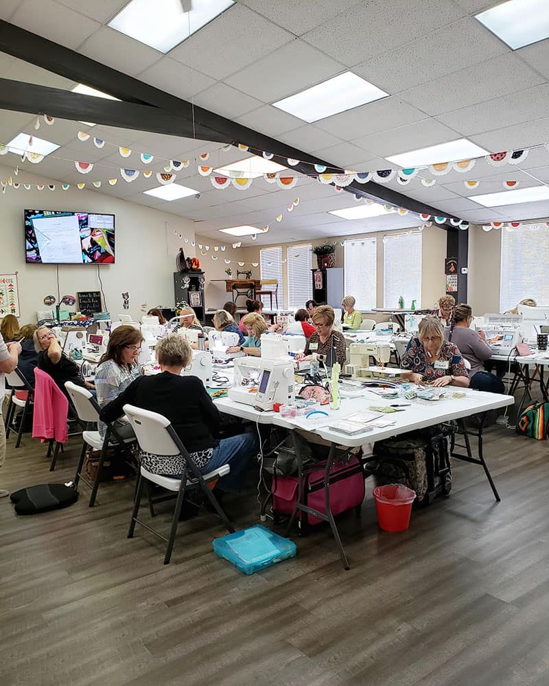 My girlfriend's quilt shoppe classroom |  Girlfriend's Day Out Quilt Event by popular Utah quilting blog, A Quilting Life: image of My Girlfriend's Quilt Shoppe classroom.