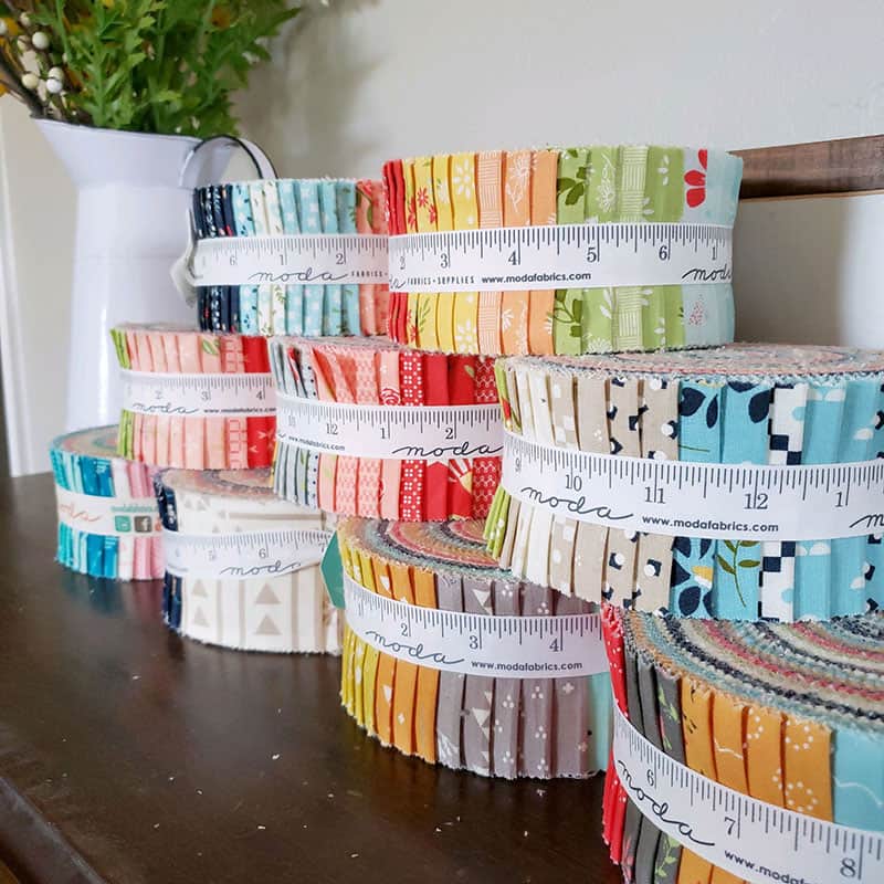 National Sew a Jelly Roll Day by popular quilting blog, A Quilting Life: image of 9 jelly rolls.