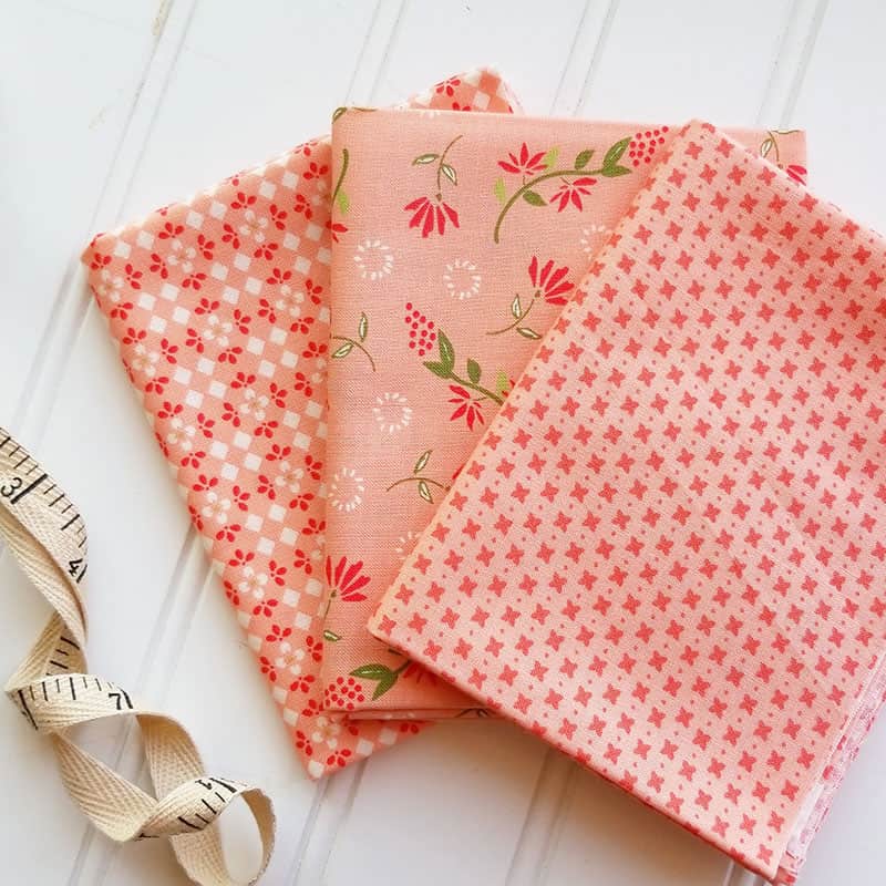 Harper's Garden Fabric Solid Coordinates featured by. top US quilting blog, A Quilting Life: image of Harper's Garden Soft Coral prints