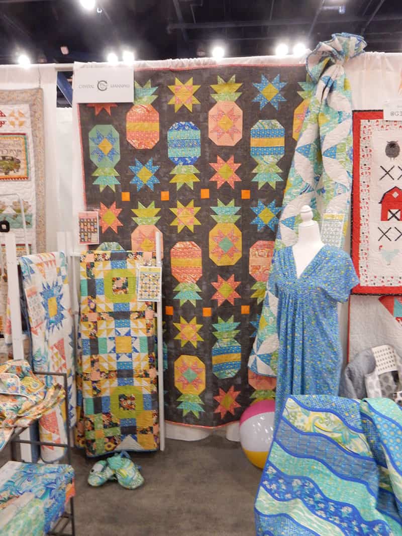 Crystal Manning Booth | Moda Booths Part 2: International Quilt Market Fall 2019 by popular Utah quilting blog, A Quilting Life: image of the Moda Kiamesha Collection booth. 