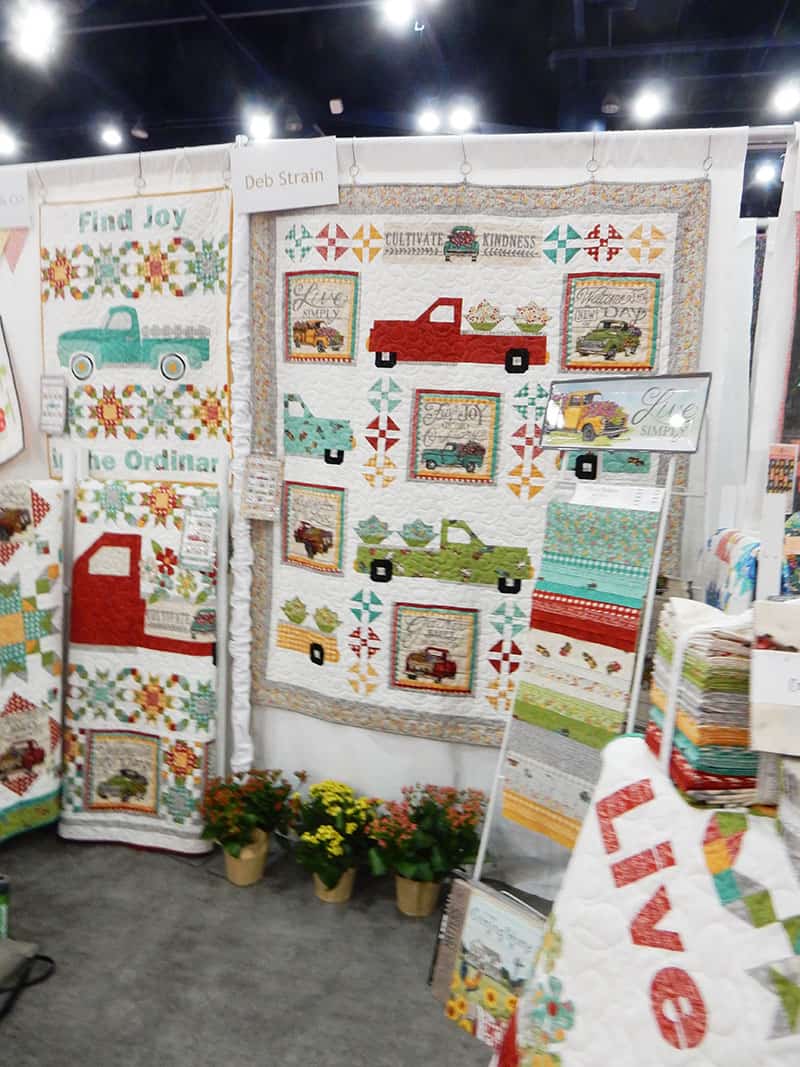 Deb Strain booth | Moda Booths Part 2: International Quilt Market Fall 2019 by popular Utah quilting blog, A Quilting Life: image of the Moda Cultivate Kindness booth.