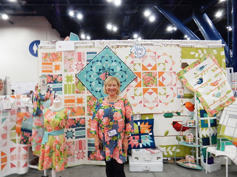 Robin Pickens Booth | Moda Booths Part 2: International Quilt Market Fall 2019 by popular Utah quilting blog, A Quilting Life: image of the Abby Rose collection booth.