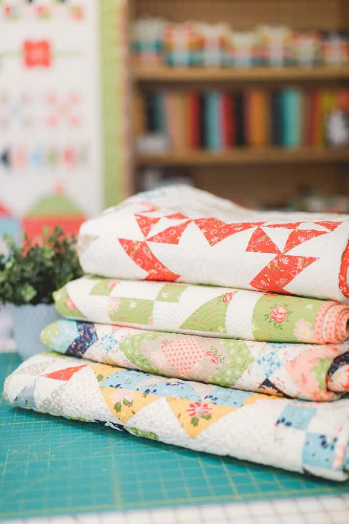 Sewing Room Organization ideas and hacks featured by top US quilting blog, A Quilting Life: image of Stack of Quilts by A Quilting Life
