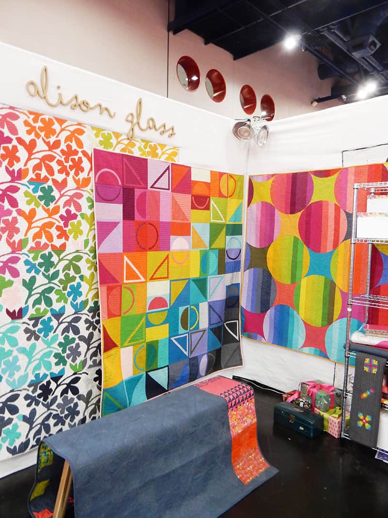 Alison Glass Quilt Booth International Quilt market fall 2019 | More Inspiration from the Houston Quilt Market by popular Utah quilting blog, A Quilting Life: image of the Alison Glass quilting booth. 