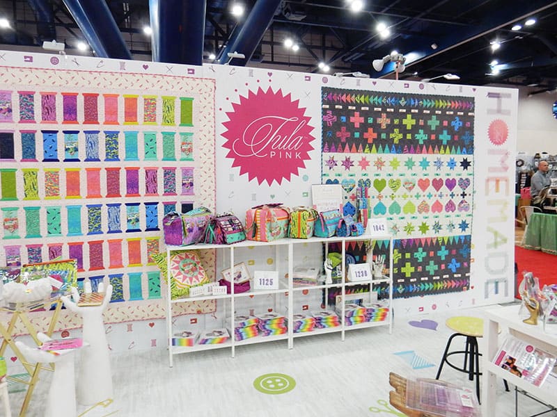 Tula Pink Homemade Booth from Fall 2019 International Quilt Market More Inspiration from the Houston Quilt Market by popular Utah quilting blog, A Quilting Life: image of the Tula Pink quilting booth. 