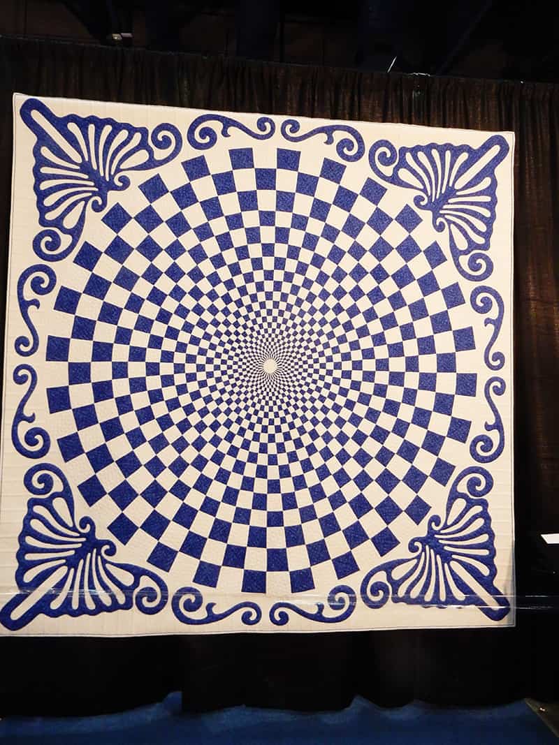 Blue & White quilt from the Sapphire Celebration Exhibit Fall 2019 | More Inspiration from the Houston Quilt Market by popular Utah quilting blog, A Quilting Life: image of a blue and white quilt. 