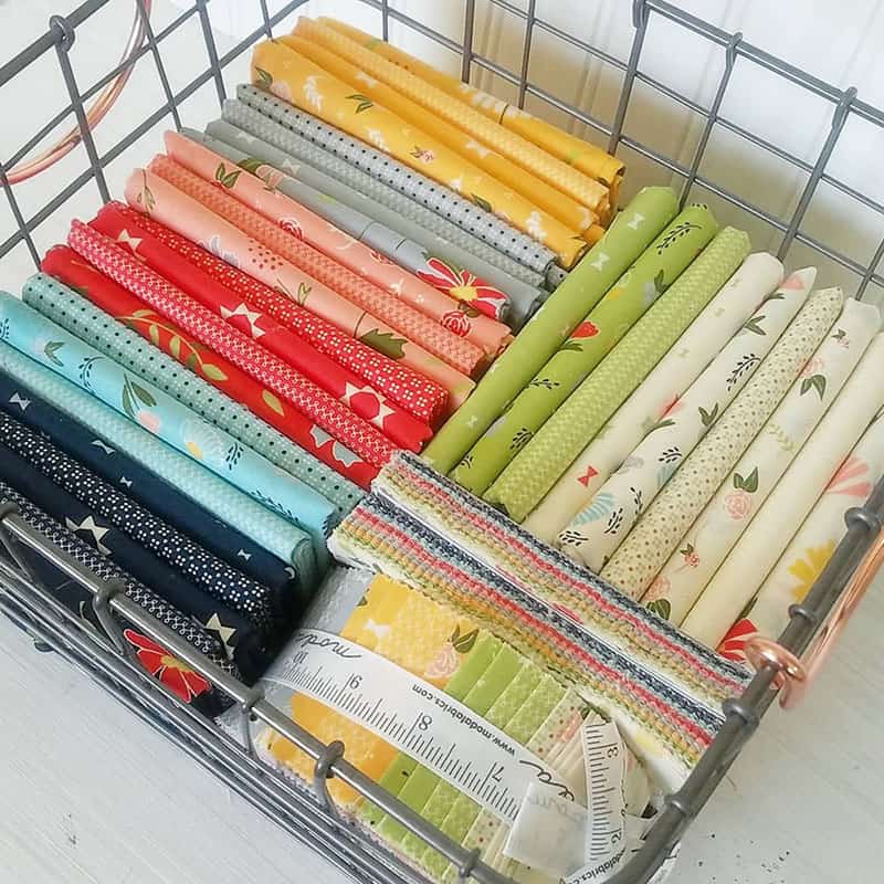 Organizing a Fabric Stash by popular Utah quilting blog, A Quilting Life:  clover hollow fabrics in a basket