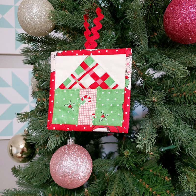 Patchwork Quilted Christmas Ornaments featured by top US quilting blog, A Quilting Life: Simple house Christmas ornament