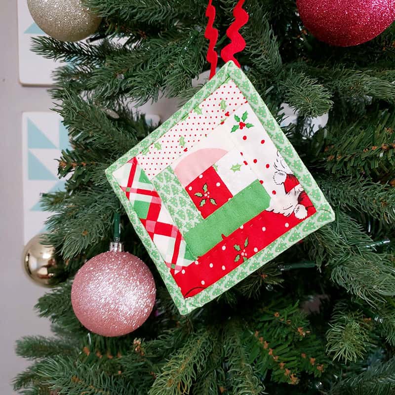 Patchwork Quilted Christmas Ornaments featured by top US quilting blog, A Quilting Life: Log Cabin patchwork Christmas ornament