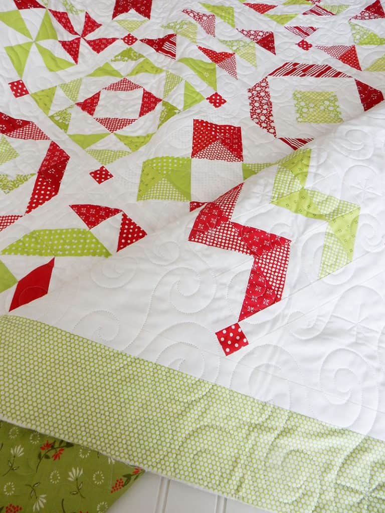 red & green half-square triangle quilt