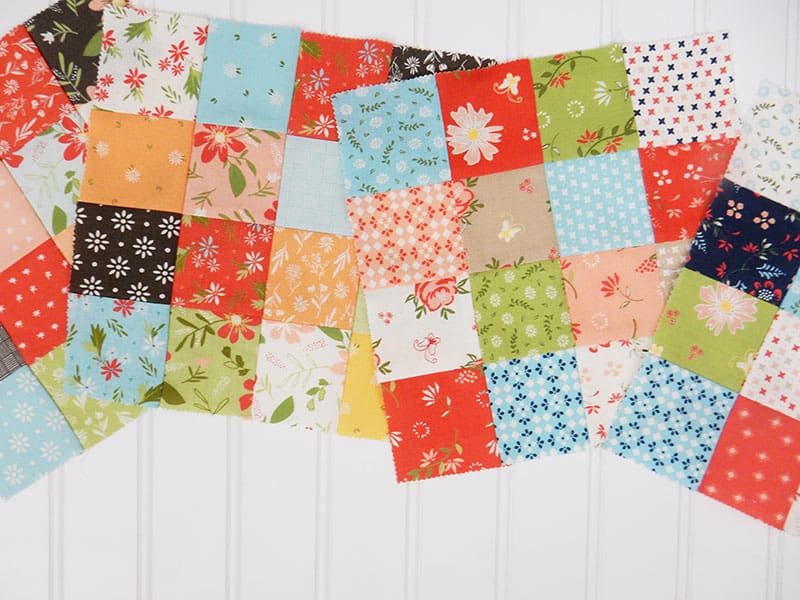 10 Quilt Piecing Tips & Tricks to Improve Piecing Accuracy featured by Top US Quilting Blog, A Quilting Life: image of scrappy blocks