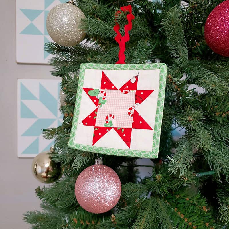 Patchwork Quilted Christmas Ornaments featured by top US quilting blog, A Quilting Life: simple patchwork star christmas ornament