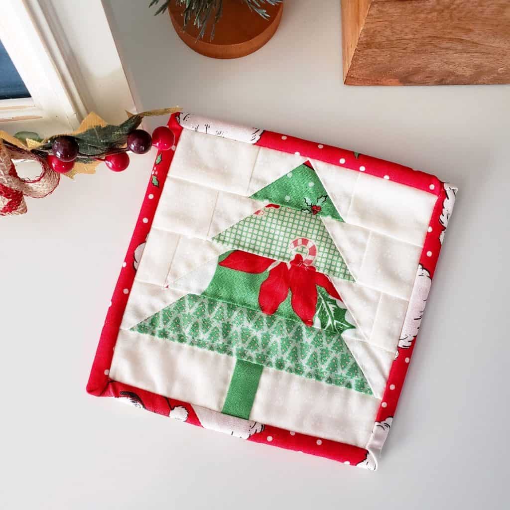 Patchwork Quilted Christmas Ornaments featured by top US quilting blog, A Quilting Life: Christmas Tree Coaster