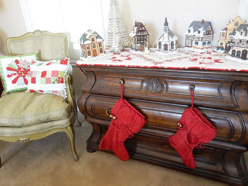 Merry Christmas featured by Top US Quilting Blog, A Quilting Life: image of Christmas village and stockings