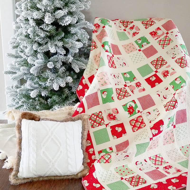 Best Tips for Storing Christmas Quilts and Decor featured by Top Us Quilting Blog, A Quilting Life: image of Four Square Christmas Quilt