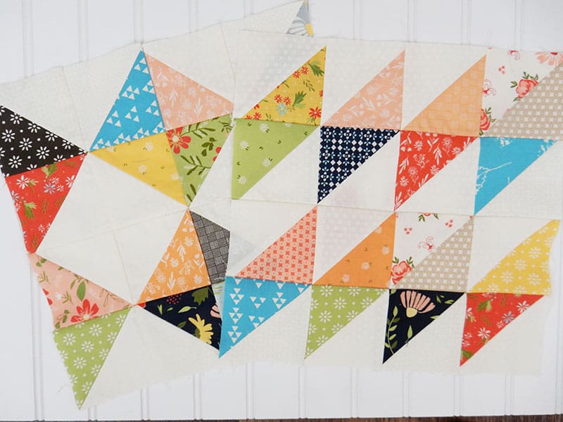 Half-Square Triangle Block of the Month December blocks | A Quilting Life Block of the Month December 2019 by popular Utah quilting blog, A Quilting Life: image of Half-Square Triangle Block of the Month December blocks.